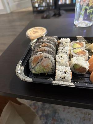 Inside of Spicy Manhattan Roll, Salmon Avocado Roll is next to it