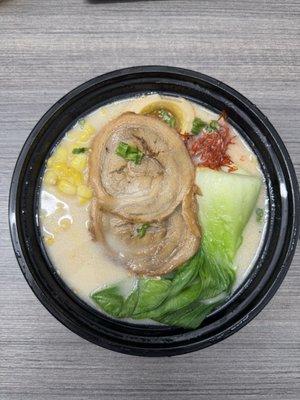 Mojo Ramen (Spicy Ramen - seasoned egg, bok choy, corn, scallions, spicy tonkatsu broth and topped with tender chashu pork)