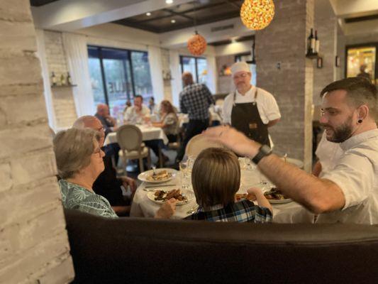 Chef James talking with guests ‍