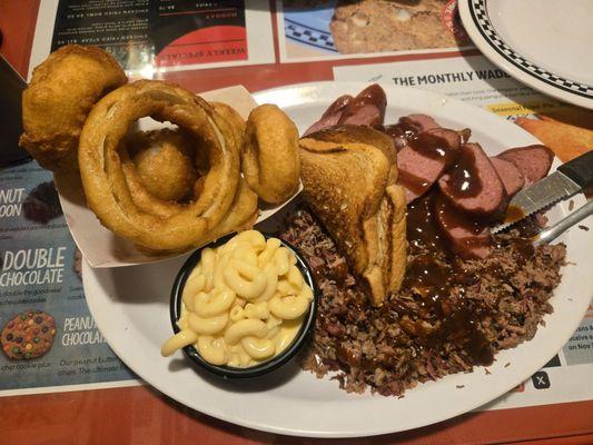 Chopped brisket,  sausage, onion rings,  Mac-N- cheese,  toast