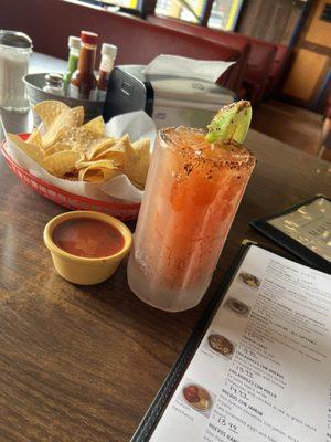 Fresh tortilla chips, medium spicy salsa with a refreshing Modelo michelada