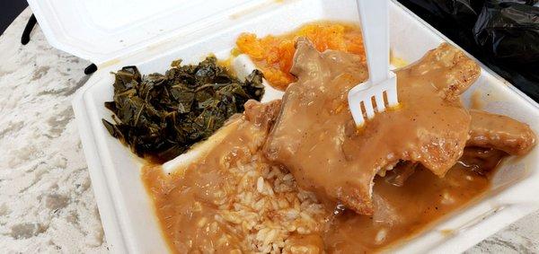 Smothered pork chops, collards, rice, and yams