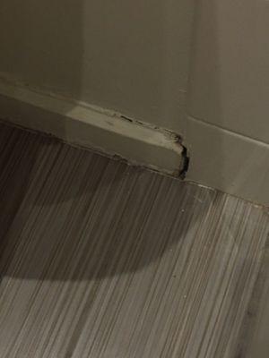 Water damage to baseboard in bathroom.