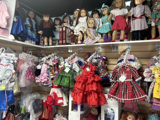 Lollipops Doll Shop interior, 18in doll shelf with their 18in doll dresses.