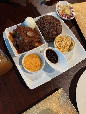 Waakye with fish and eggs (rice and beans)