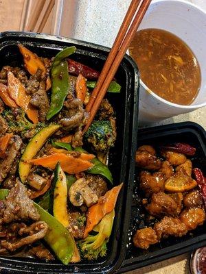 Hunan beef, orange chicken (half devoured)& the necessity: LARGE hot & sour soup  not pictured: pork fried rice, because we ate it.