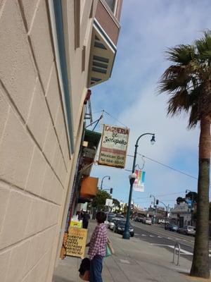 The sign in front of the store.