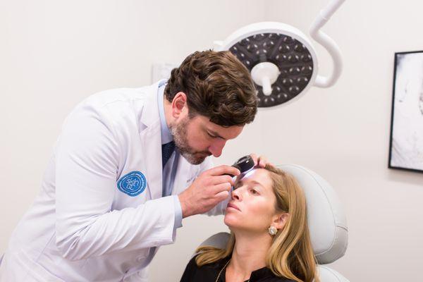 Comprehensive skin exams are performed at SkinDC with sophisticated imaging technology including dermatoscopes.