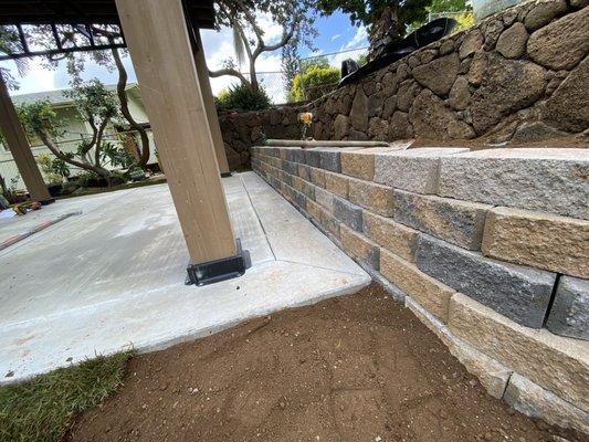 Finished platform and garden bed. Notice how nicely the retaining wall ties in with the new concrete & existing stone wall!