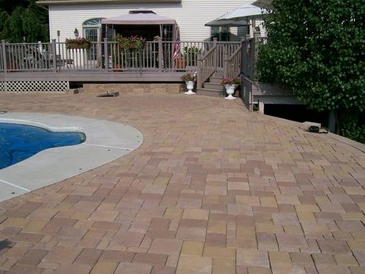 2600 square feet of pavers surrounding a pool. We had to cut both the inside edge as well as the outside for this curvy pool!