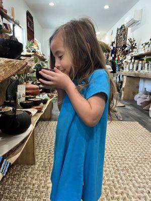 Toddler enjoying all of the candles.