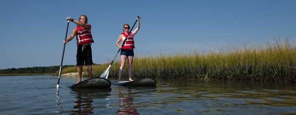 Rent standup paddleboards for cruising around the island or surfing the beach break