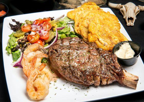 Cowboy Ribeye 22oZ , Jumbo Shrimps , Fried plantains