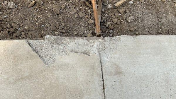 Damage to new concrete done during apron demolition