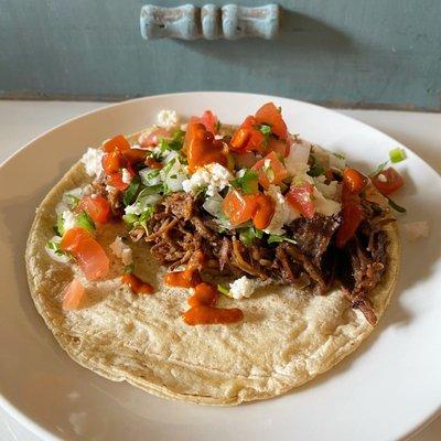 Taco time!! Fresh tortilla, barbacoa, queso fresco, pico de gallo, cilantro/onion mix, and spicy red salsa all from Las Lupitas!