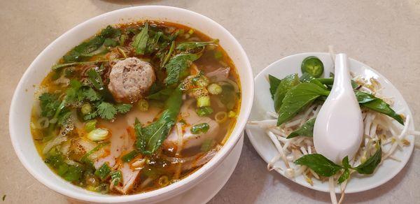 Bún bò Huế - Vermicelli noodles in spicy beef soup w/well-done beef, pork paste, and pork meatball - Very tasty!