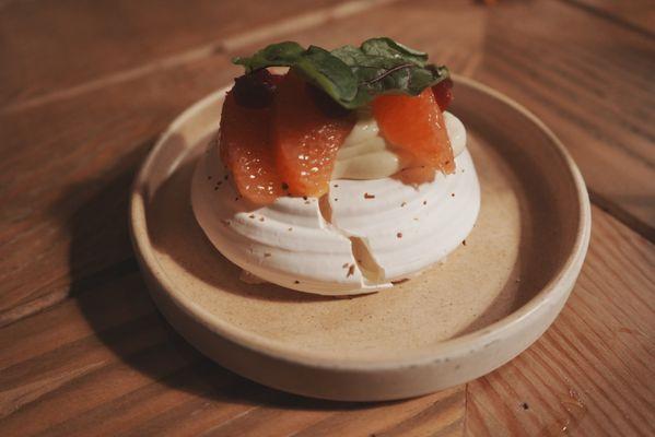 Grapefruit Pavlova. Chalk like exterior texture with a creamy rose flavored custard interior.