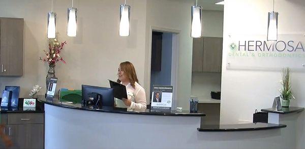 Warm and friendly reception staff at Dallas dentist Hermosa Dental & Orthodontics