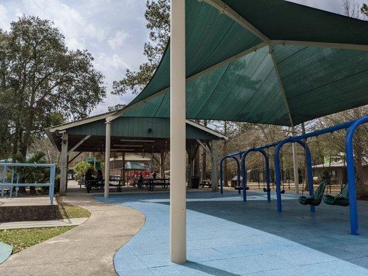 Seating in the shade and swing set