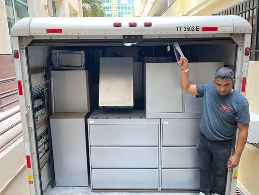 Moving file Cabinets to the dumpster.