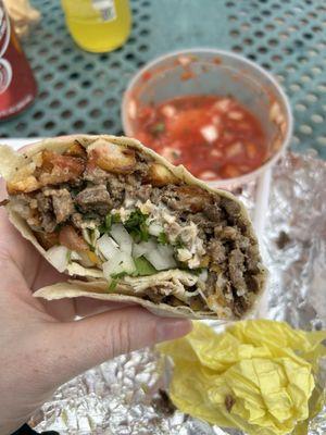 Papa's California Burrito. Carne asada, crispy potato, verde, onion and cilantro.