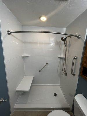 In stock special tub to shower conversion with bench and 2 shelves.