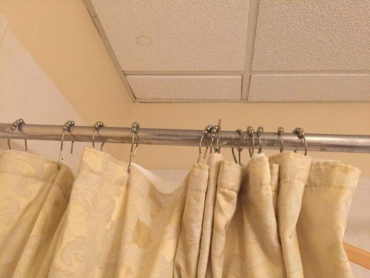 Cheap cheap cheap shower curtain hangers. Rusted to boot along with an old rusted curtain rod. So poorly maintained.