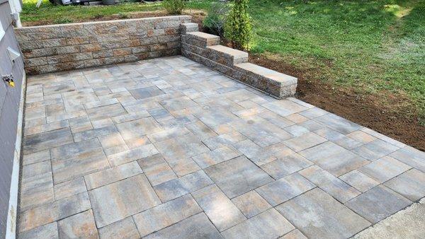 Finished product!! Westchester blend pavers and stone wall.