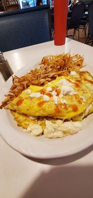 Western omelet with feta cheese, added hash browns, well done.