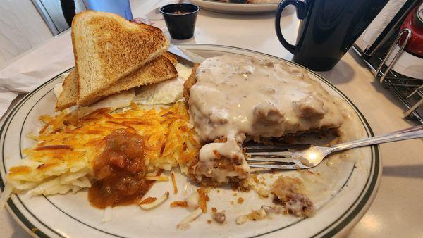 Chicken fried steak and eggs.