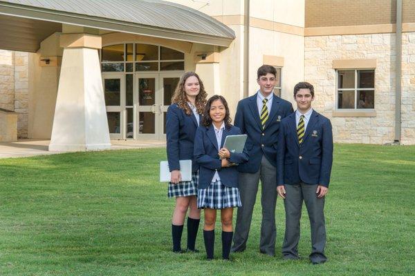 St. Dominic Savio students stand near the front entrance.