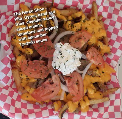 Our Horseshoe - Pita, Gyros, surrounded by cheese fries, topped with onions, tomatoes and cucumber Tzatziki sauce