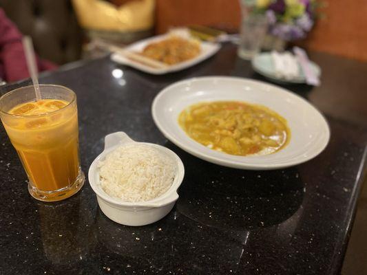 Yellow Curry with chicken and a sweet Thai tea.