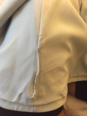 Hole ripped inside seam of brand new dress. Then poorly repaired without alerting