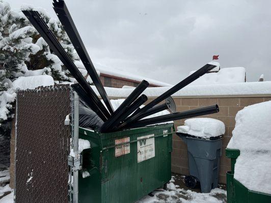 Completely full dumpster from illegal dumping by All My Sons Moving