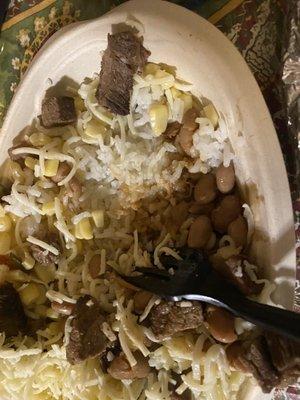 Steak burrito bowl: scraped off pills of cheese: 5 beans, no veggies, Boiled rice and 6 pieces of steak