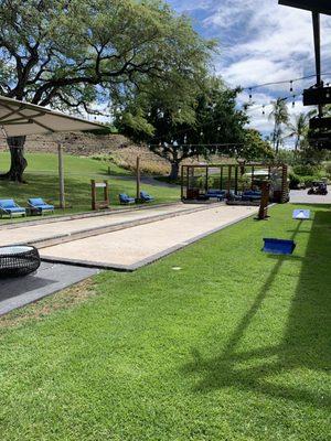 Secret bocce court and corn hole game