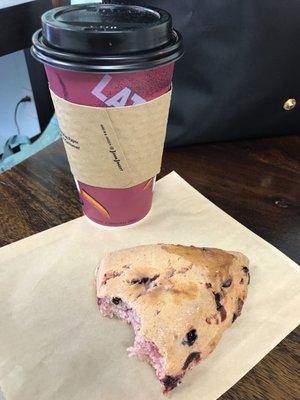 Delicious raspberry white chocolate scone and a regular sized (16 oz) latte!