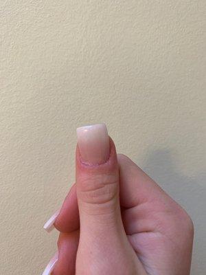 The slightly crooked nail on the thumb