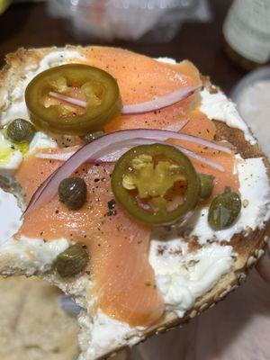 Sesame bagel with cream cheese and lox