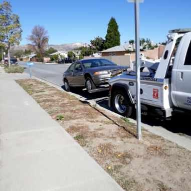 Tow style service for a car.