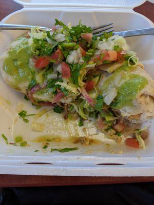 Carnitas burrito ($13), with fixings from the ample condiments bar.