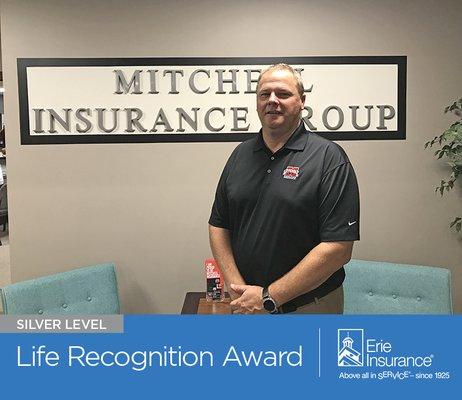 Mitchell Insurance Agency, located in Plain City, Ohio, accepts the Silver Life Recognition Award from Erie Insurance. (614) 873-1088.