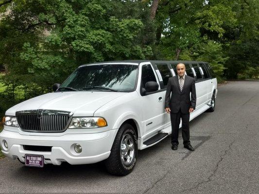 Lincoln Navigator super stretch limousine with one of our professional chauffeurs.