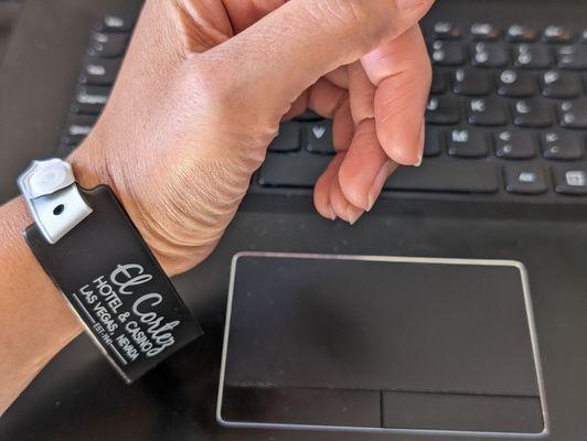 Prisoner-style bracelet that also announces to the whole world where you're staying.