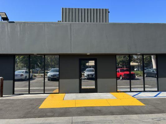 Reflective mirrored silver tint for an office building in Tustin for privacy and heat rejection.