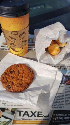 Chocolate chip cookie, donut holes, medium coffee, and the paper to start the morning off right