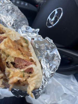 Breakfast burrito with sausage and bacon