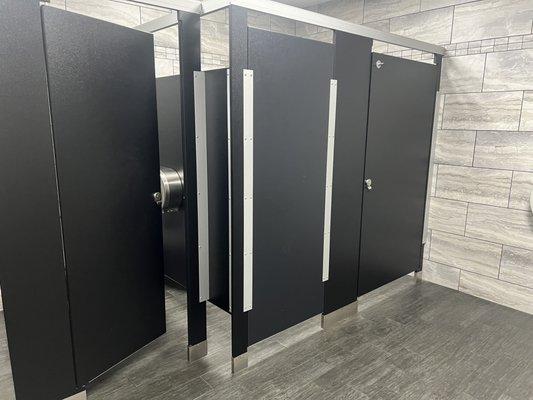 Stalls with nice doors and hooks inside the stall