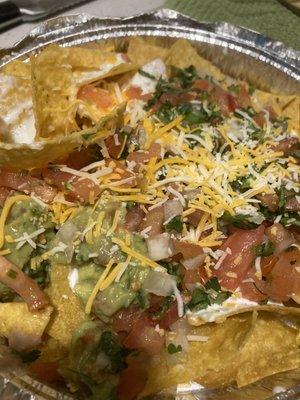 Veggie nachos cold and soggy- nothing melted just the little cheese you see SPRINKLED ON TOP! $14 with tax- returned!